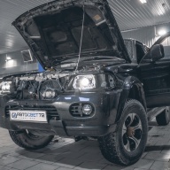 Линзы в фары Mitsubishi Pajero Sport I
